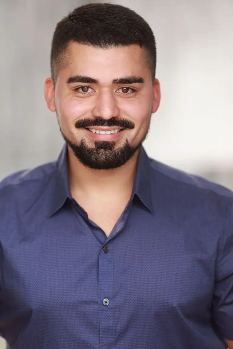 Portrait of Tomás Reyes, a fictional reviewer (stock photo)