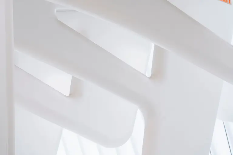 White geometric architectural details in soft daylight, representing the Meridian Studio website